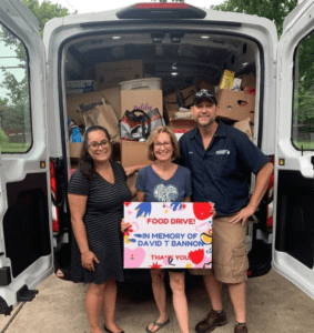 Pictured is food bank staff supporting Christine Patti who raised more than $53,000 and 4,700+ pounds of food in 2024. Her annual fundraiser to honor her son David T. Bannon has helped to provide thousands of meals to our neighbors.