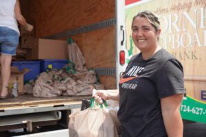 Dominique visits a local food distribution to help fill the summertime meal gap. 