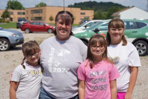 Michelle and her daughters visit a Corner Cupboard Food Bank distribution in Greene County. 