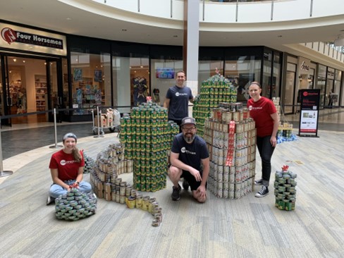 People standing around cans