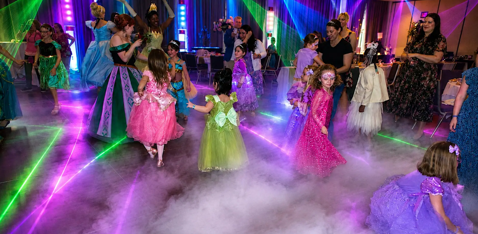 kids dancing in colorful princess dresses